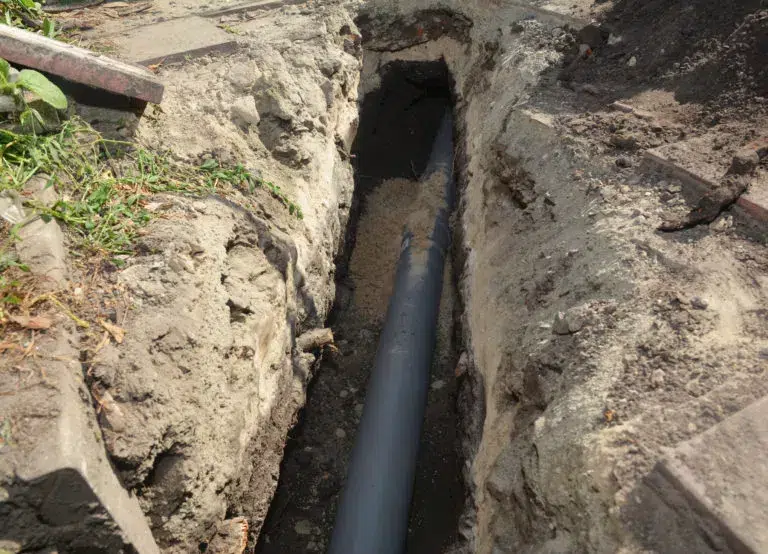 Sewer pipe in ground trench