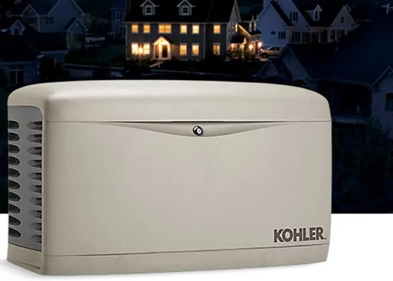Kohler generator with background image of home at night with lights on inside