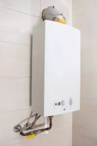 Tankless water heater installed on a wall.