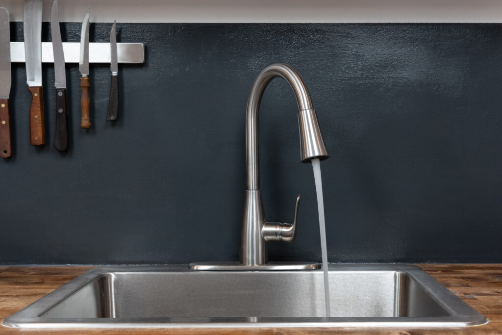 Kitchen sink with water running from the faucet